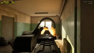 WARDOGS player firing a machine gun down an indoor corridor