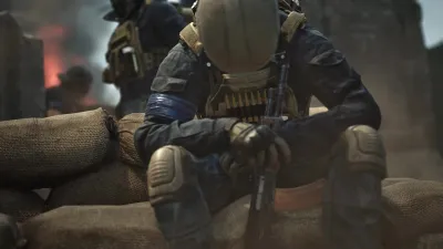 WARDOGS players firing from behind a sandbag position