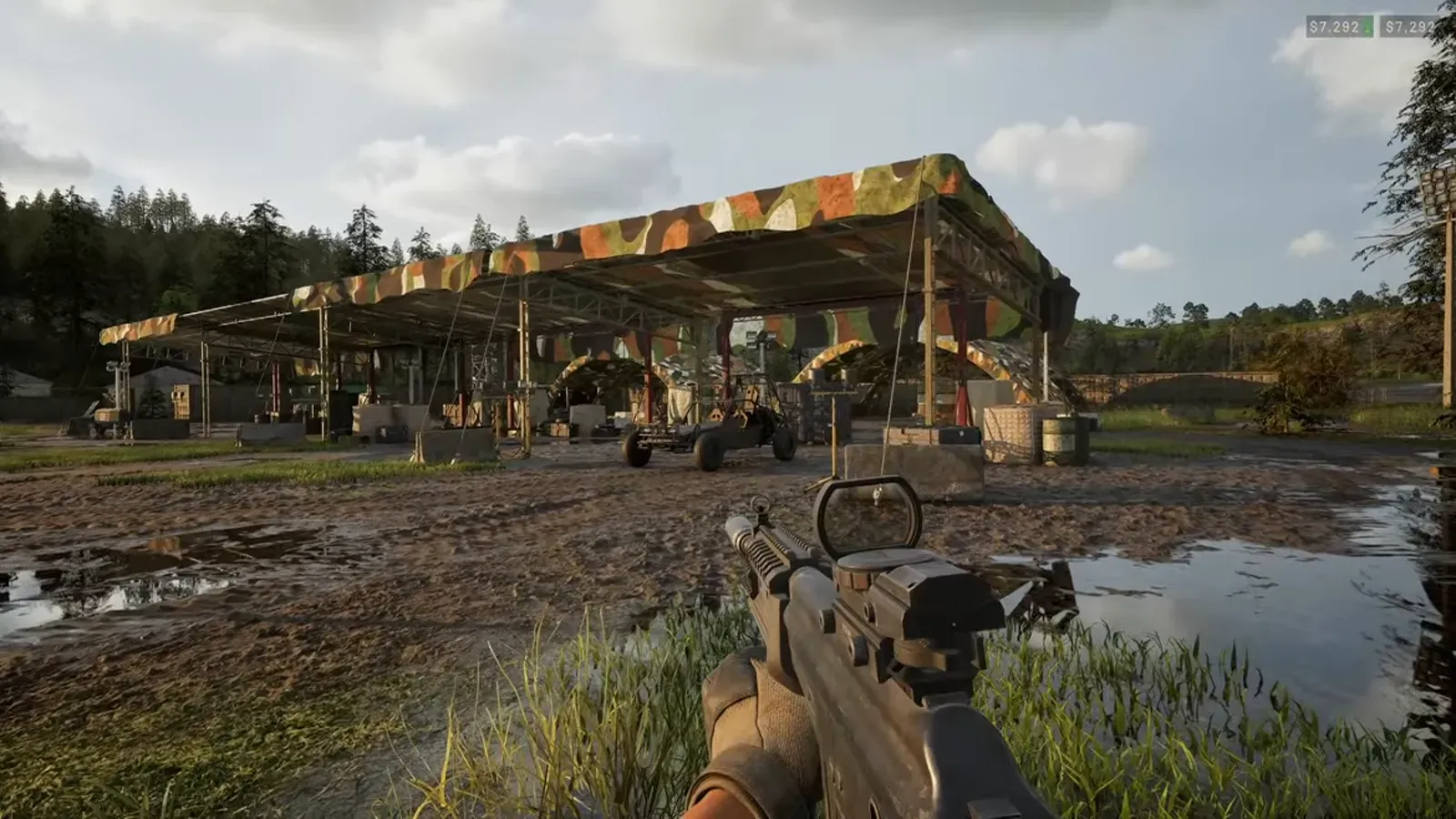 WARDOGS player holding a weapon beside cover near a puddle
