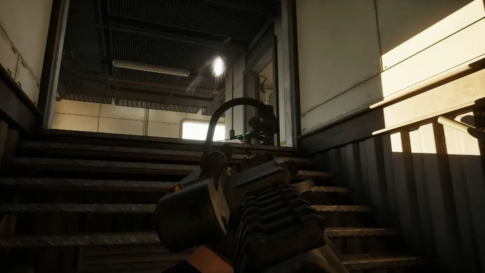 A WARDOGS player pushing up a stairwell with a weapon raised