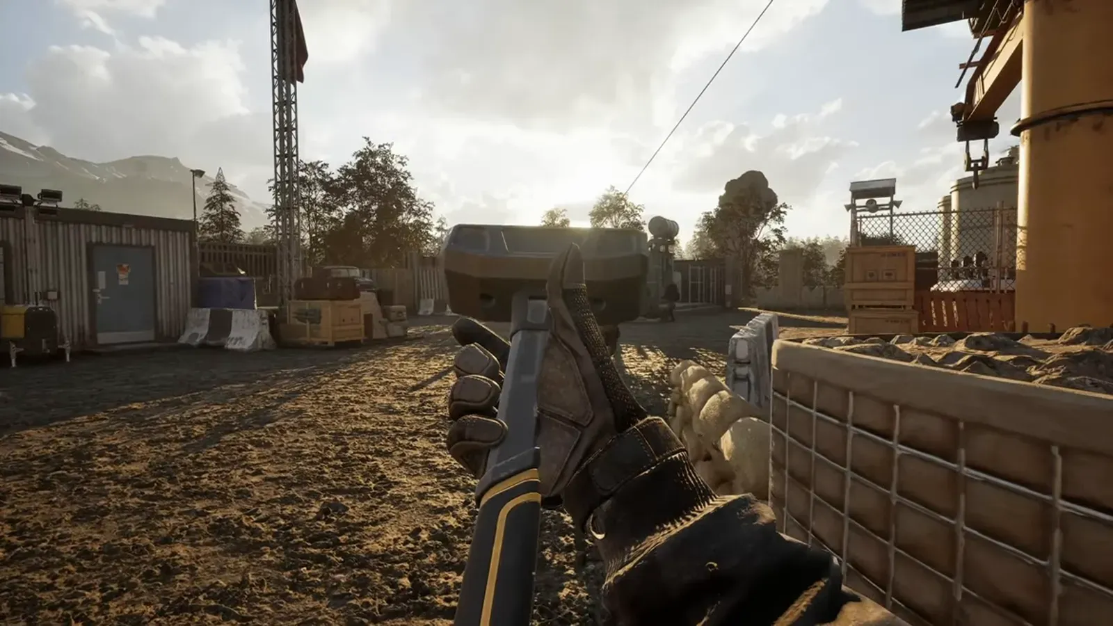 A WARDOGS soldier walking past stacked supply containers